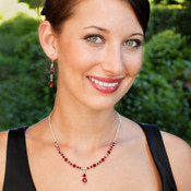 Crystal Lite Necklace in Sterling Silver Siam (Red) shown with the Crystal Dangle Earrings in Siam (Red).