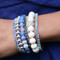 Stretch Bracelets shown in (left to right) Swarovski Crystal in Sapphire, 7mm Sterling Silver, 8mm Cornflower Agate Gemstone, Swarovski Crystal in Montana, 3mm Sterling Silver, 10mm White Alabaster Gemstone, Swarovski Crystal Aquamarine.
