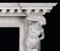 A pair of strong Hercules is depicted on the legs of the marble mantel, carrying the weight of the mantel shelf