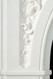 Beautiful sculpted arch is surrounded by beautiful florals in our Andrea English Marble Mantel