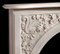 The Andrea marble mantel has beautiful floral details in the corners