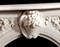 A center arch small basket of flowers is standard with The Andrea English Marble Mantels