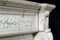 Neoclassical design elements are featured on this ornate French Marble Mantel