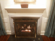 A bolection mantel in limestone, paired with a wood mantel shelf similar to our Daphne makes a beautiful combination!