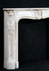 Louis XV styling in all details of this marble mantel
