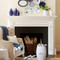 A white wood mantel with dentil molding and fluted legs, for design inspiration