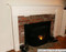 A customer supplied image of their Leesburg mantel sized to work with a heath that is the same width as the facing on the wall.  The mantel legs 'straddle' the hearth and the scribe molding makes the transition.