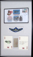 Saburo Sakai commemorative First Day Cover, WWII replica bullion Naval Aviator wings, autograph ink-cut signature by Saburo Sakai adhered to an ace playing card and second Ace Card with a pencil-cut signature of Masajiro “Mike” Kawatoa fragment skin piece off of the wing of an A6M2 Japanese Zero.
