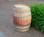 "Authentic reclaimed oak wine barrel with metal hoops, stamped with Napa Valley logo. Perfect for home décor, garden planters, rustic bars, and DIY furniture projects."