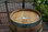 "Authentic reclaimed oak wine barrel with metal hoops, stamped with Napa Valley logo. Perfect for home décor, garden planters, rustic bars, and DIY furniture projects."