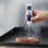 ThermaLite thermometer reading temperature of steak