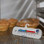 Horizontal spirit-filled fridge freezer thermometer placed inside refrigerator to display temperature reading.