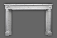 The Versailles Neoclassical style with beautifuly tapered legs on this marble mantel.