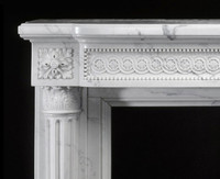 Detail image of the marble mantel breast plate.