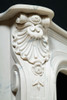 Note the exquisite detailing on the corner volutes and shell design