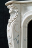 Volutes, shells and acanthus leaves are feature on this marble mantel