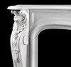 Detail image of the corner shell design of this marble fireplace mantel