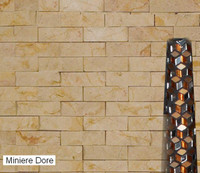 Miniere Dore 1 x 3 split face tiles, with earthtone colors including sand, rust and an occasional hint of cream.