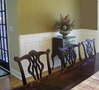 Raised panels painted white in dining room.