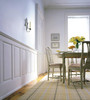 White raised panels wainscoting in dining room.