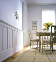 White raised panels wainscoting in dining room.