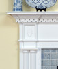 Detail image of the Colonial fireplace mantel.