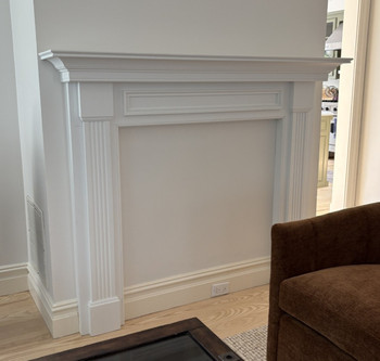 Not every mantel ends up surrounding a fireplace. the leesburg is still the focal point of this room.