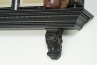 Egg and dart molding with acanthus leaf corbels.