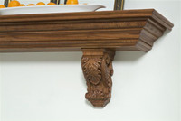 Beautifully hand carved corbels with egg and dart crown molding.