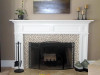 A dramatic face lift featured a Concord mantel and new surround facing mosaic tiles