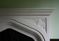 Nice geometric pattern in the spandrel of this Tudor stone mantel