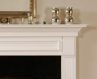 The detailed framed across the header of the mantel gives the Fredricksburg mantel a unique look.