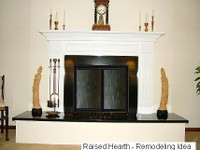 Custom Harrisburg fireplace mantel on raised platform.
