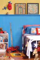 Beaded Birch paneling used in a boy's bedroom.  A tall wainscoting application