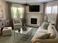 Lessburg mantel finished in an off white color.