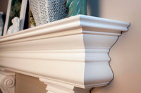 Beautifully curved and detailed crown molding is featured on the Courtyard Fireplace Mantel Shelf.  Optional corbel brackets shown