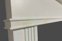 Slight discoloration on the left side of the mantel.