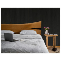 Black fluted wall paneling adds a modern look to any room in your house.
