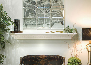 Detailed dentil molding is featured on this traditional shelf