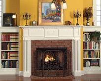 The Victoria Fireplace Mantel Surround, with twin reeded columns, includes lantern appliques.