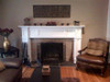 A fireplace update, featured an Oxford mantel painted white