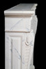 View the side of the French marble mantel