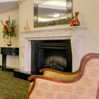 This French marble mantel is in our beige perlato with fine Louis XVI styling