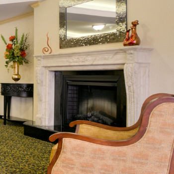 This French marble mantel is in our beige perlato with fine Louis XVI styling