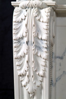Acanthus leaf design extends down each mantel leg.