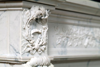Wreath design above mantel leg.