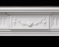Floral design in the center of the Federal marble mantel.