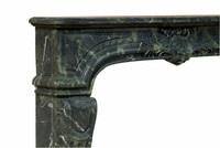 A fine example of Louis XIV styling in our Fontaine Marble Mantel