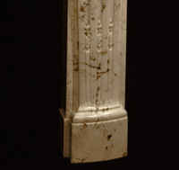 Detail image of the mantel leg base on the Fontaine marble mantel
