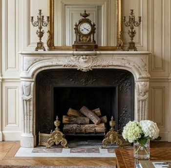 Exhibiting the magnificent artistry of 18th-century French design, the Fontaine, this mantel beautifully captures the Regence to Louis XV transition style. Crafted from a warm, warmly charactered cream marble with rich, naturally occurring earth-toned veining and inclusions, it infuses any sophisticated space with a sense of historic permanence and old-world romance.